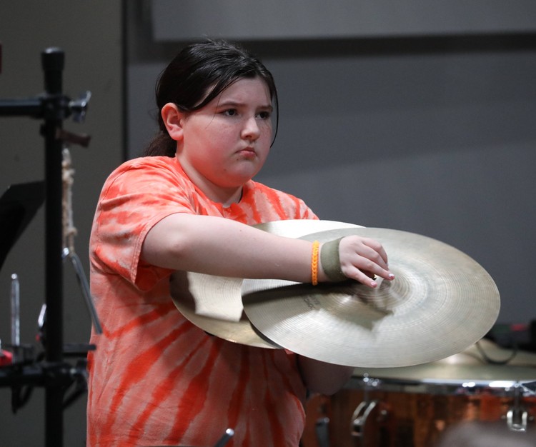 A member of the Fifth and Sixth Grade Band performs.