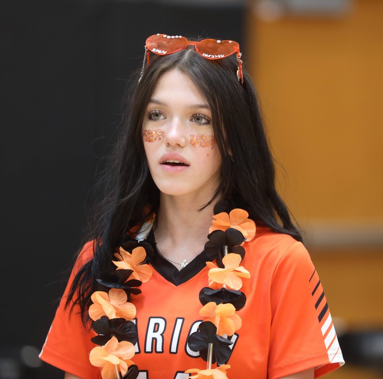 A student sings the national anthem