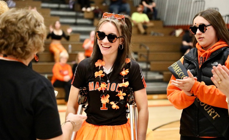 The Homecoming Queen smiles and chats 