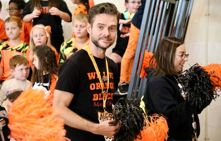 Staff attend a pep rally at Marion Elementary