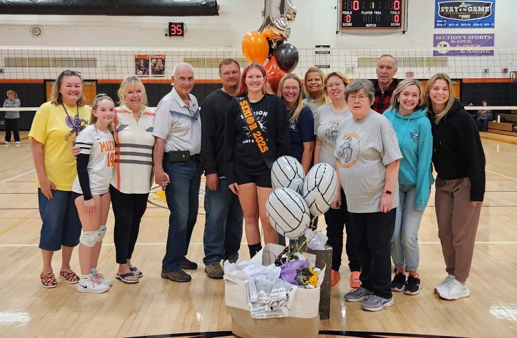 Senior volleyball player with her family