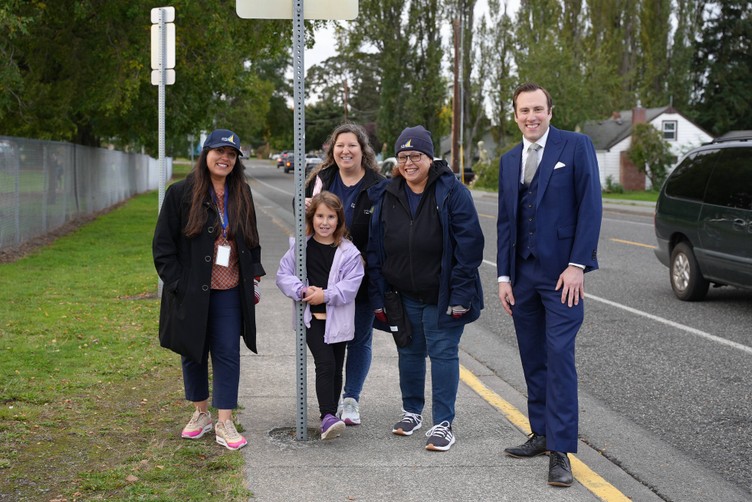 city officials walking a student to school