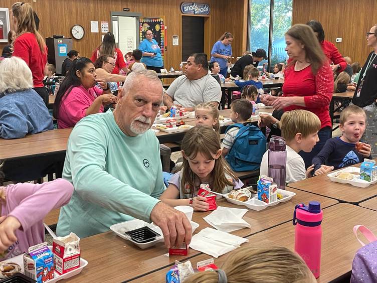 grandparent and grandchild at breakfast table