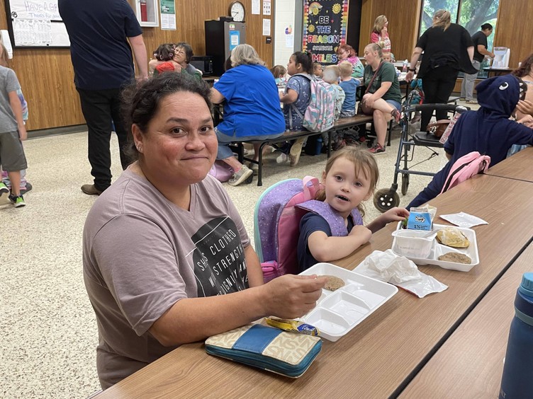 grandparent and grandchild at breakfast table