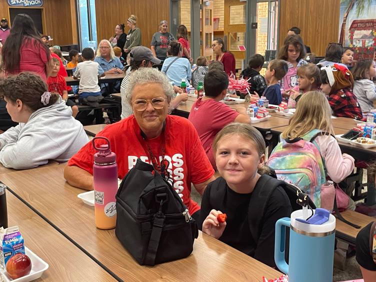 grandparent and grandchild at breakfast table