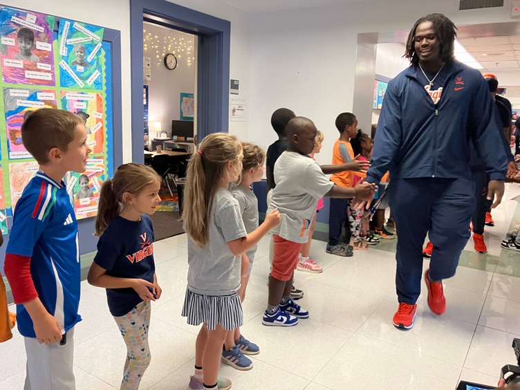 UVA Football parades through Trailblazer