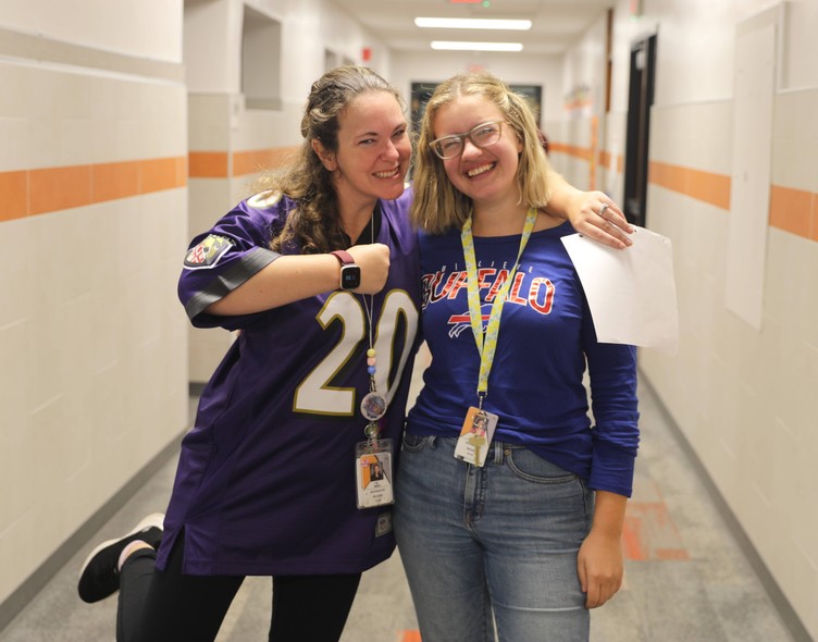 Staff members in sports jerseys