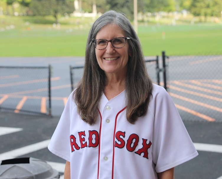 A staff member sports a Boston Red Sox jersey