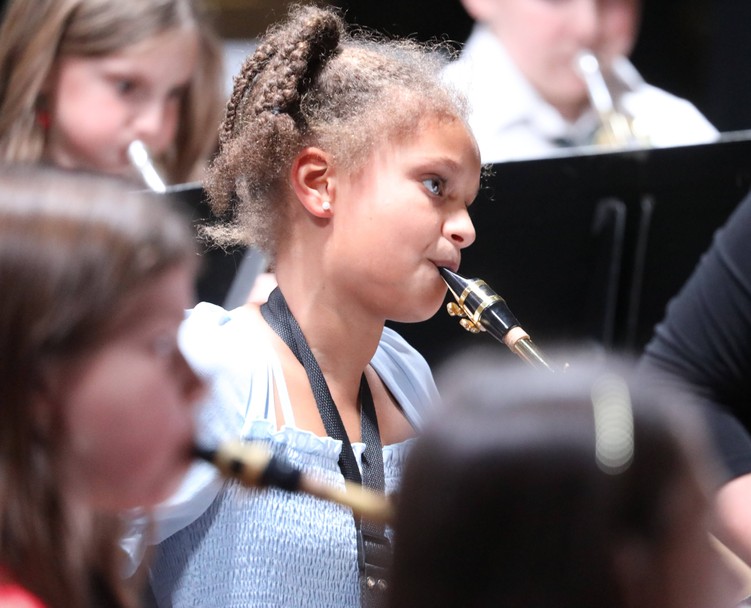 A member of the Fifth and Sixth Grade Band performs.