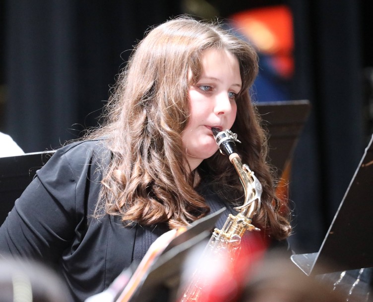 A member of the Fifth and Sixth Grade Band performs.