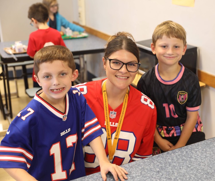 Students and staff wearing sports jerseys