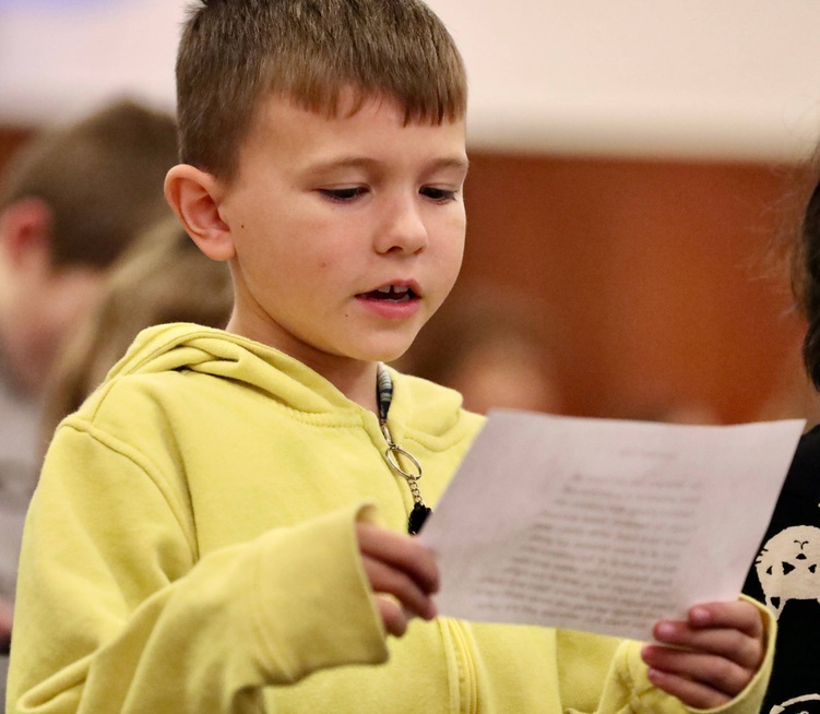 A student performs a reading 