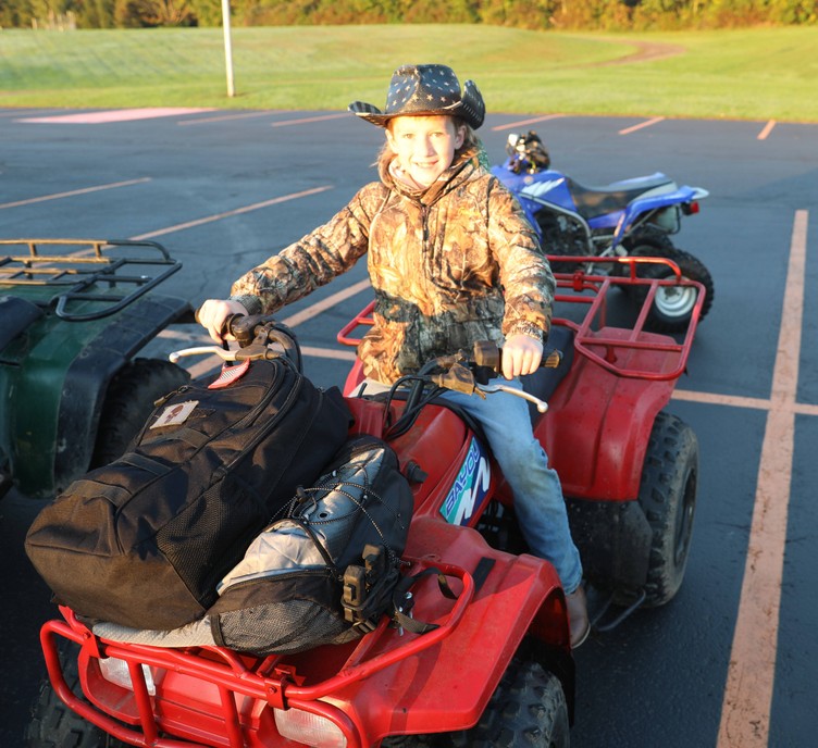 A student sits on a four-wheeler