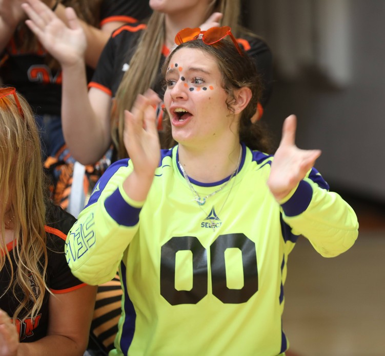 A student cheers at the pep assembly