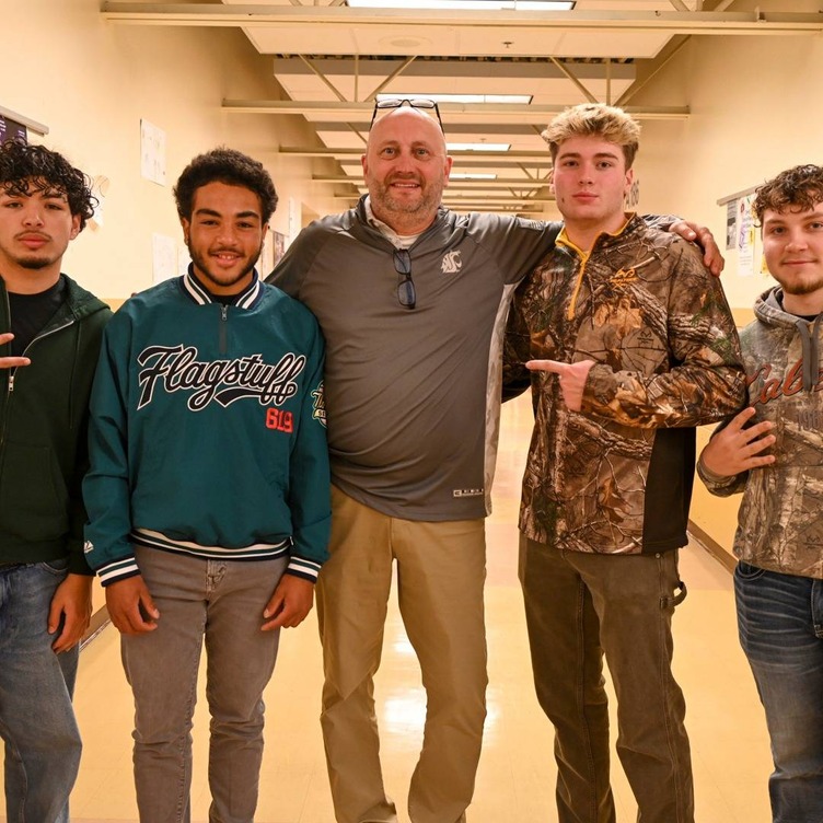 students and principal nate salisbury in camo