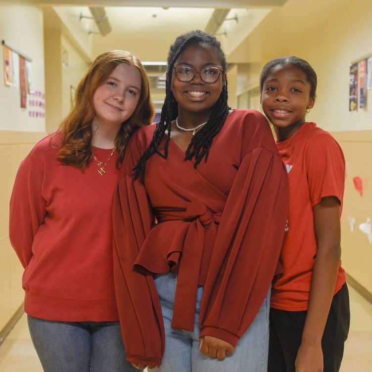 students dressed in red