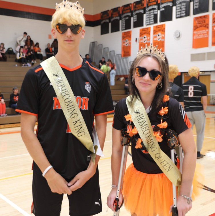 The Homecoming King and Queen smile 