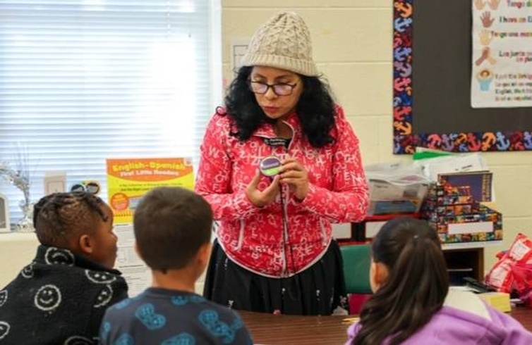 A DLI teacher works with students at Winecoff Elementary school.