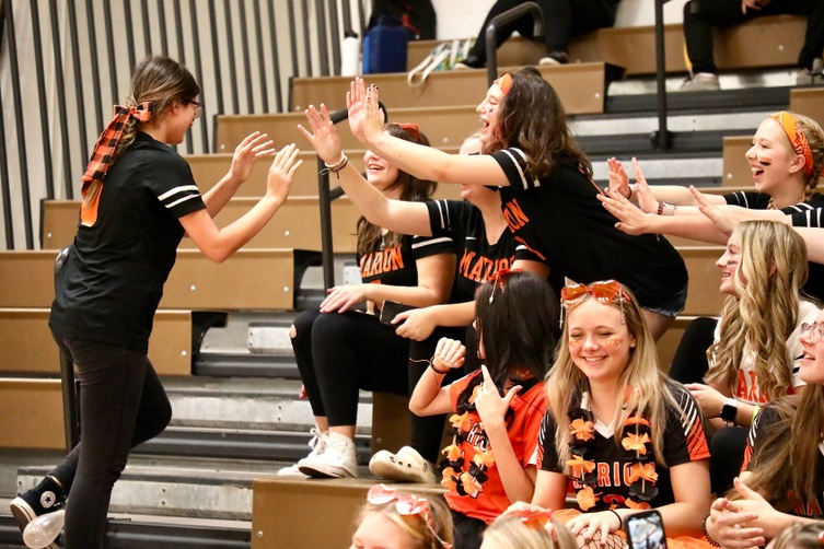 Students congratulate the winner of the balloon stomping contest 