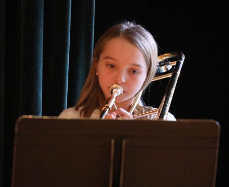 A member of the Beginner Band performs.