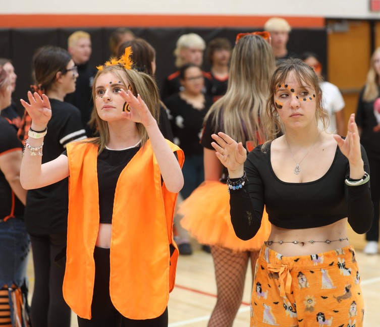 Students use ASL to sign the national anthem