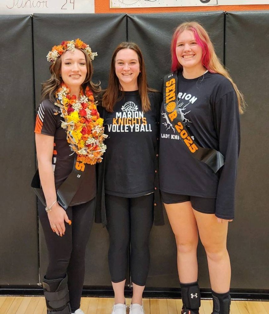 Senior volleyball players with coach