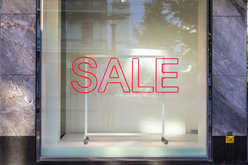A sign saying 'SALE' in a shop window
