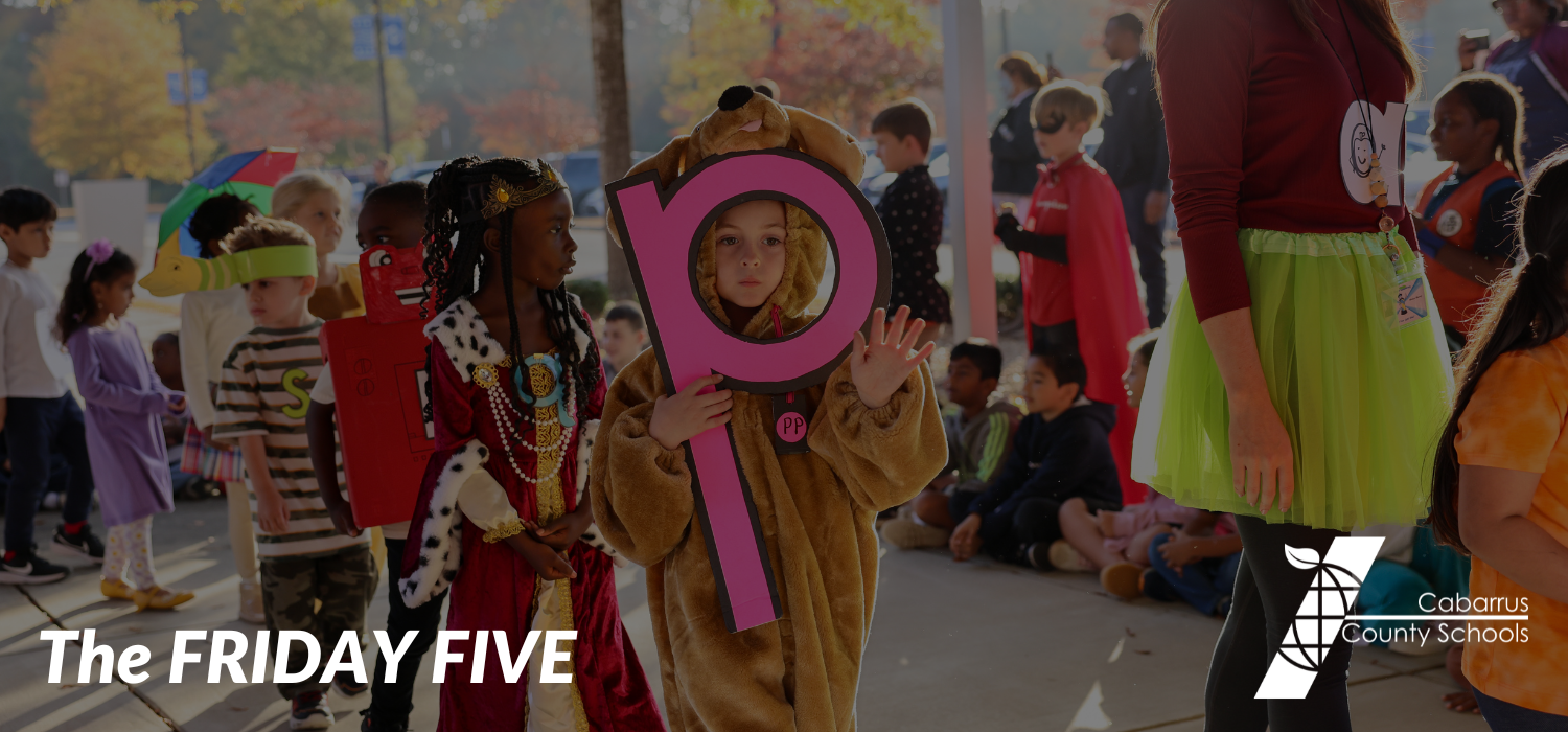 A student at Boger Elementary holds up five fingers during the Letterland parade.