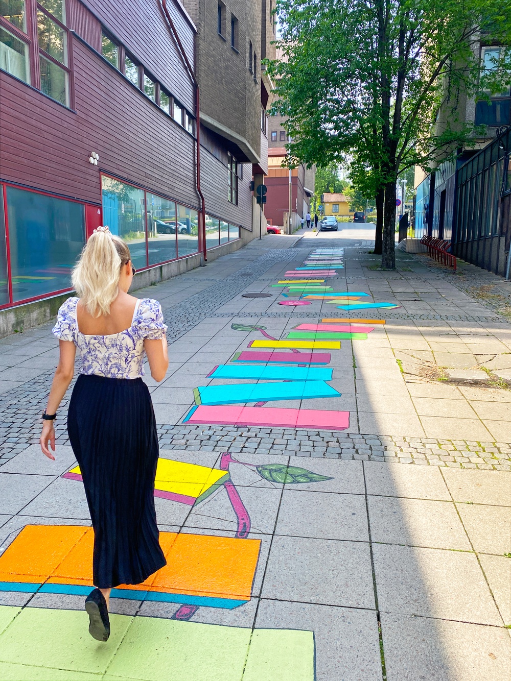Woman walking on colorful ground