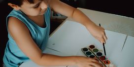 A child painting on a paper