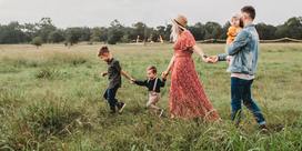 A family walking through a field