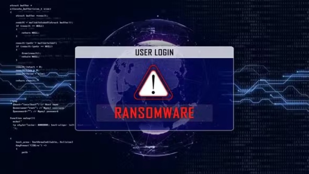 A computer desktop background, and the text appearing with a warning sign saying "RANSOMWARE! in red letters.