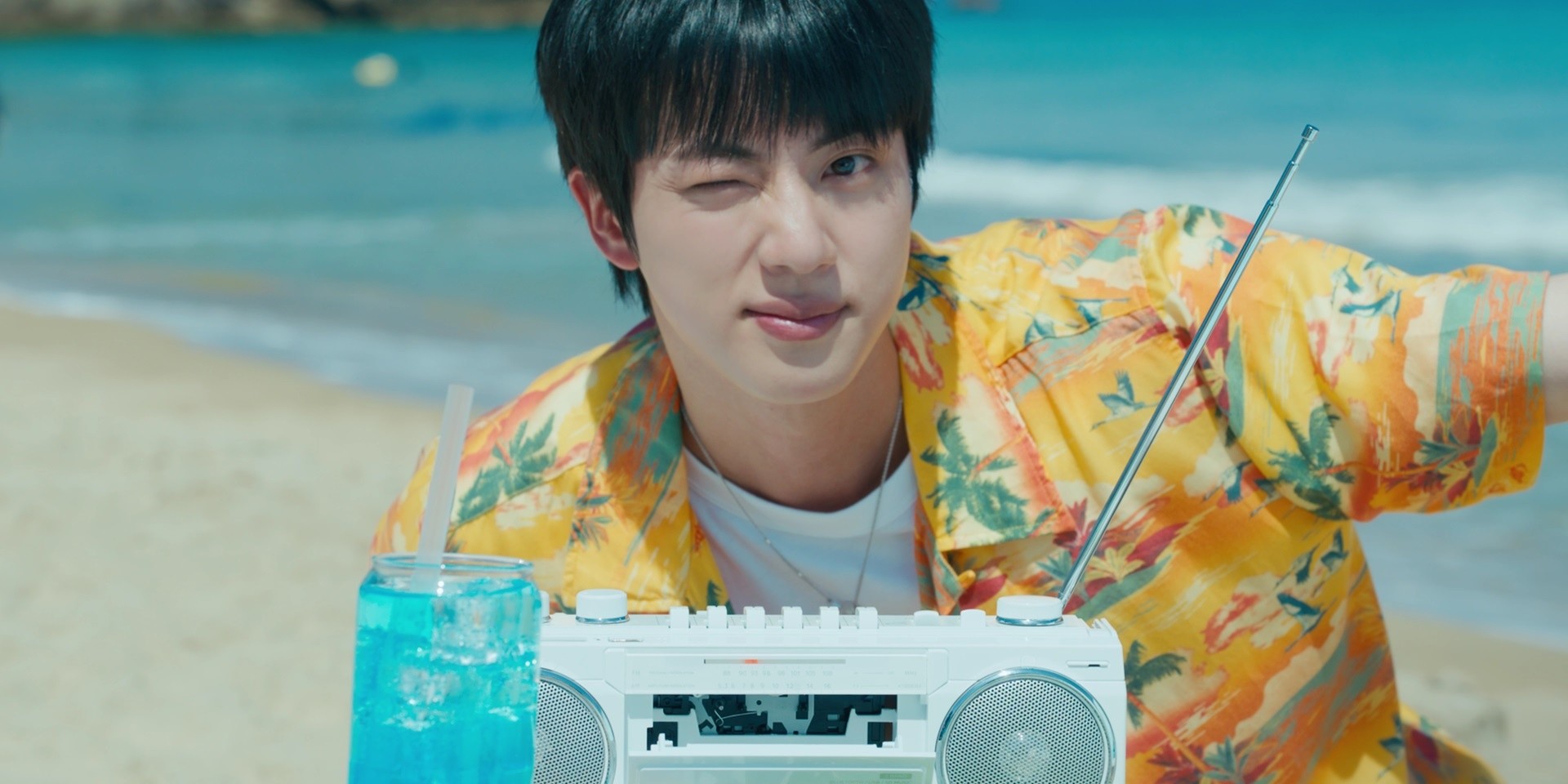 Take a beach break with BTS' Jin in the music video for the full version of 'Super Tuna' – watch