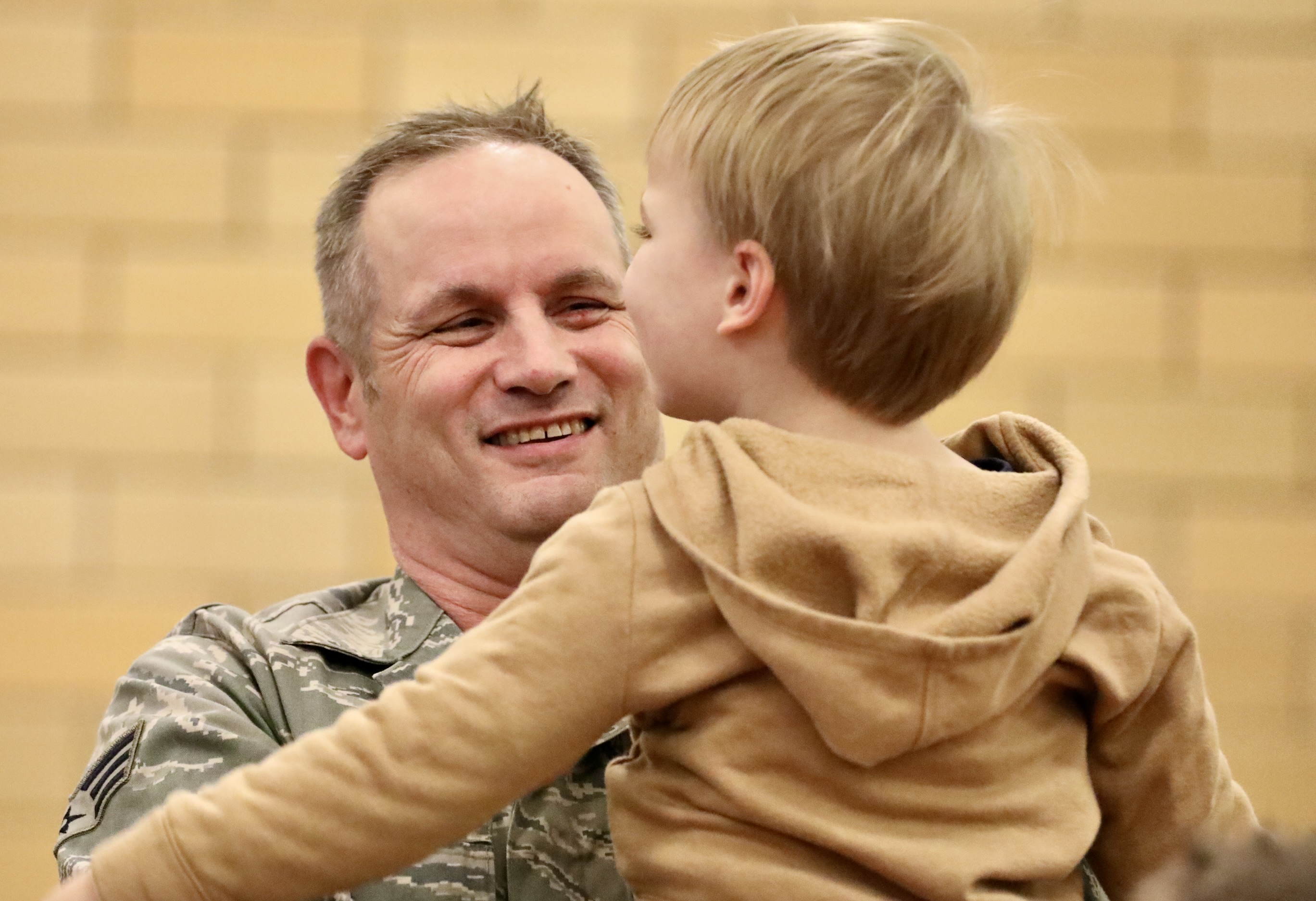 A veteran smiles while interacting with a child at Marion Elementary School on Nov. 8, 2024. 