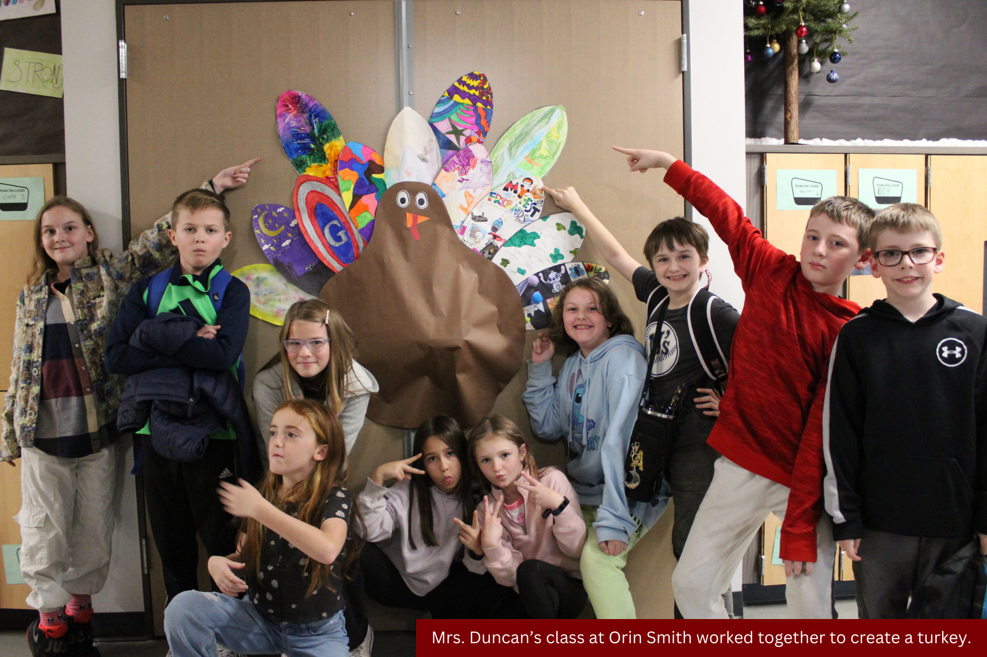 A photo of students in front of a piece of turkey art they created.