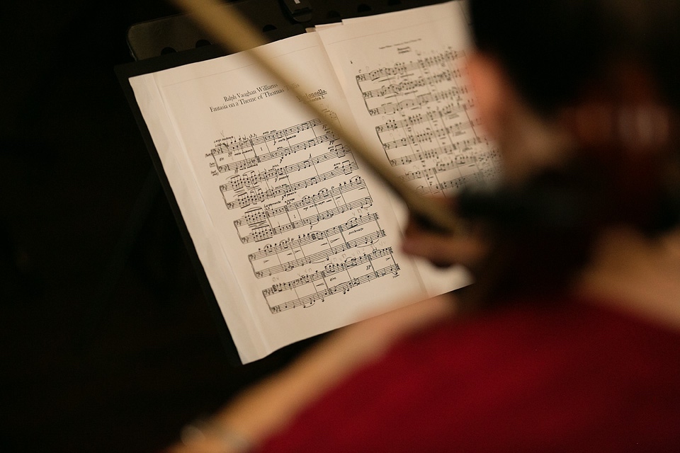 Cellist reading music