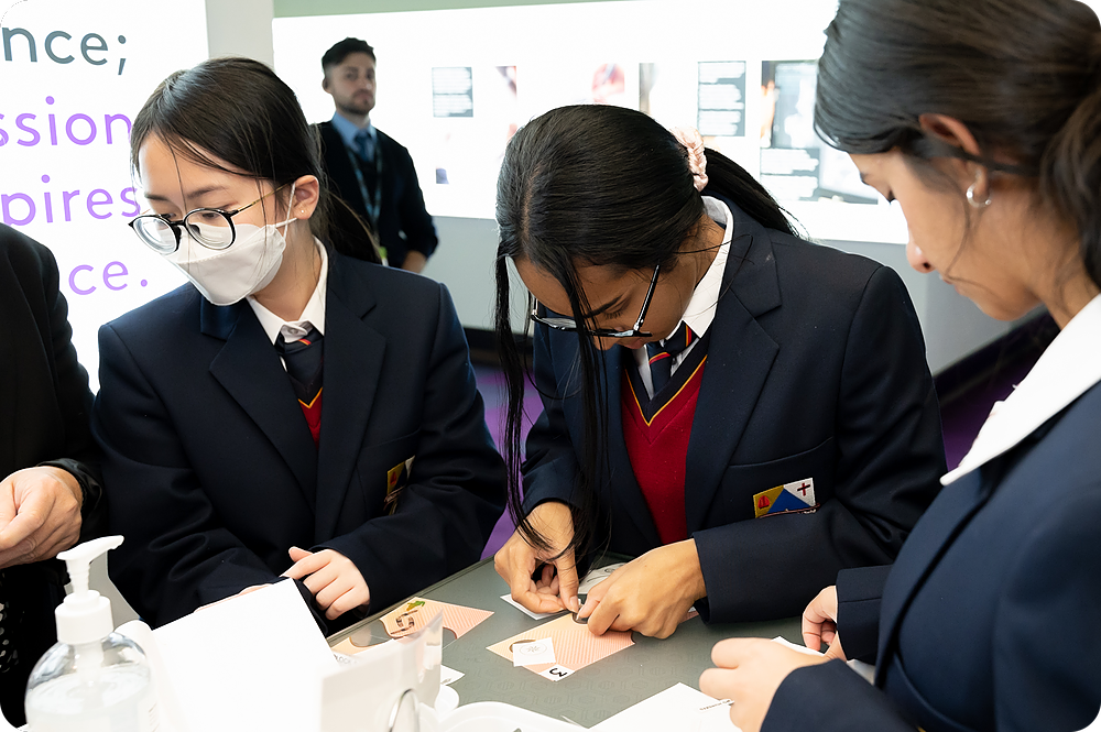 Students making their own play banknotes