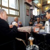A group of men in a cafe on Umar al Mukhtar street.