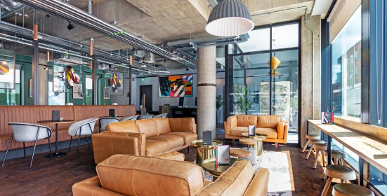 The Hendrick Hotel in Smithfield, the lobby is filled with funky art, brown leather couches and exposed pipework