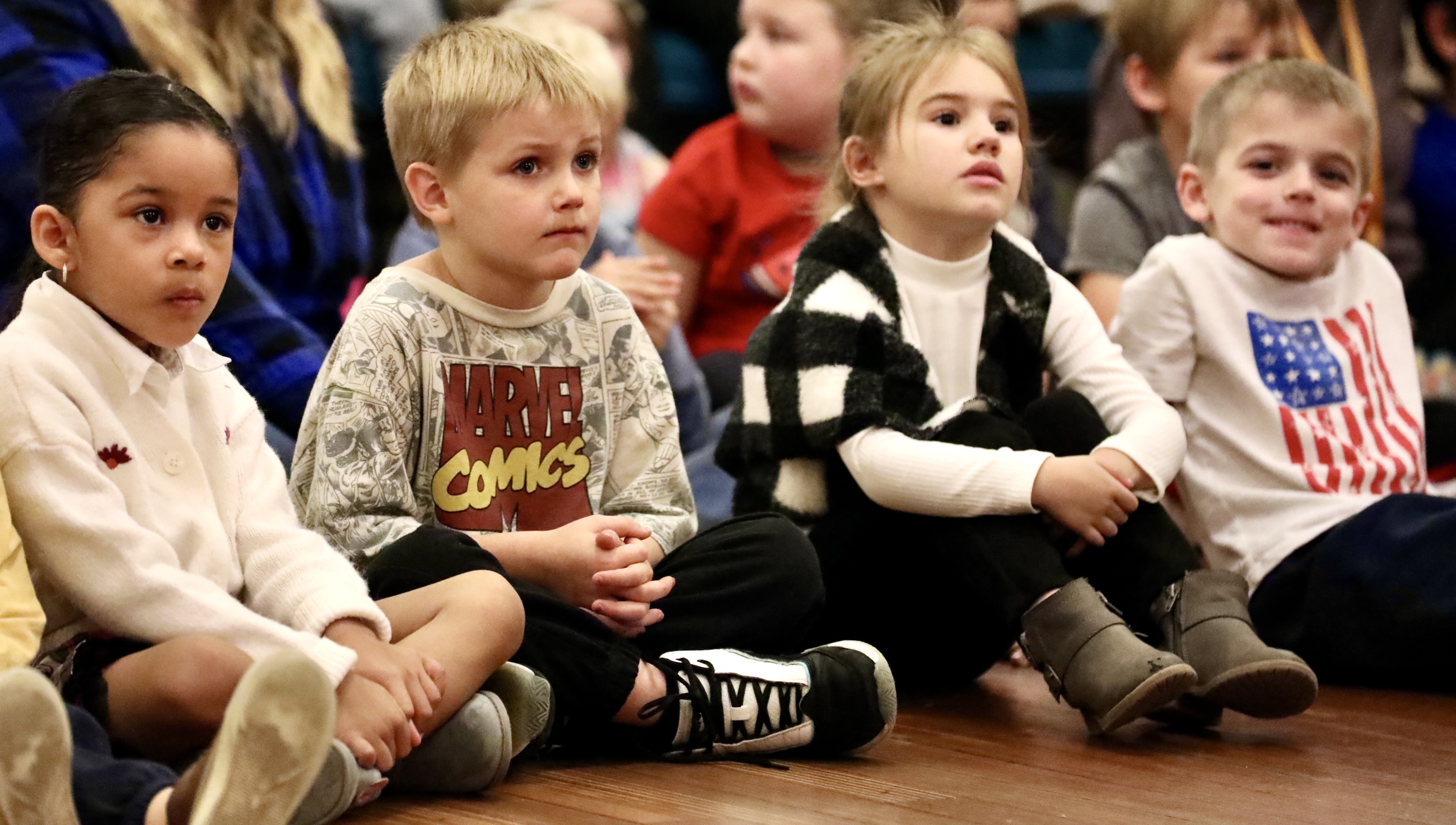 Students listen during the ceremony 