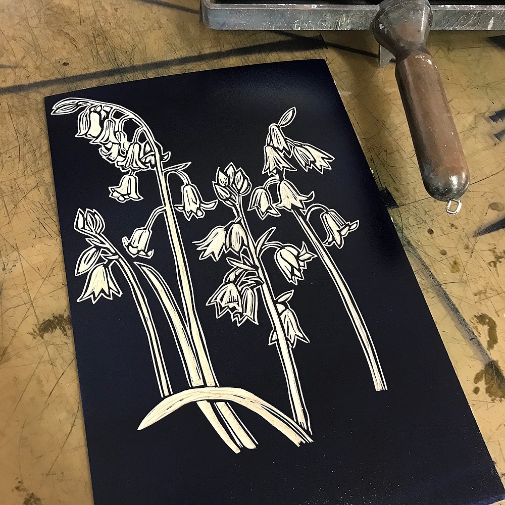 An inked up lino block featuring bluebells