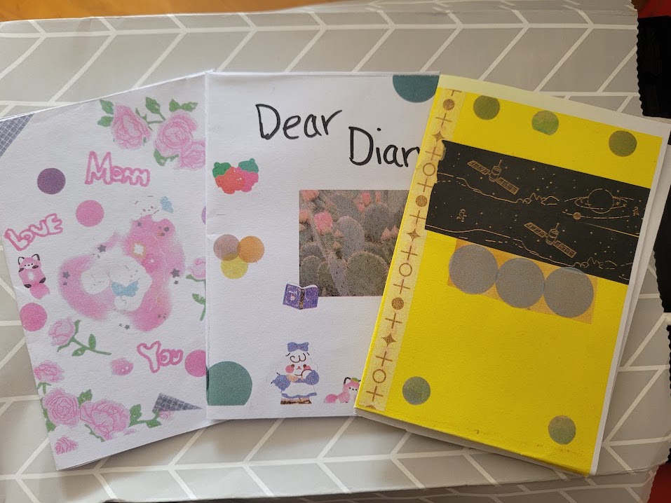 Three different zines - Mom Love You, Dear Diary, and Minecraft