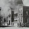 British troops watch as the King George Jewish School burns during anti-Jewish riots in December 1947
