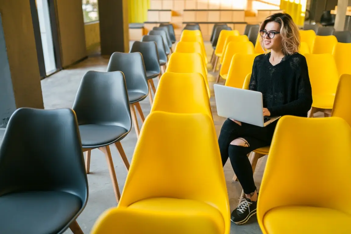 Photograph of a person preparing for graduate school life on their laptop.