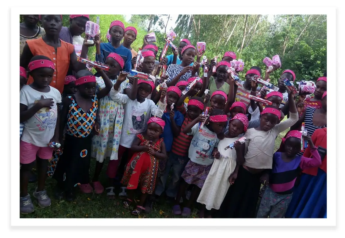 A group photo of the orphaned children in East Seme, after another of Carol Awuory's gatherings