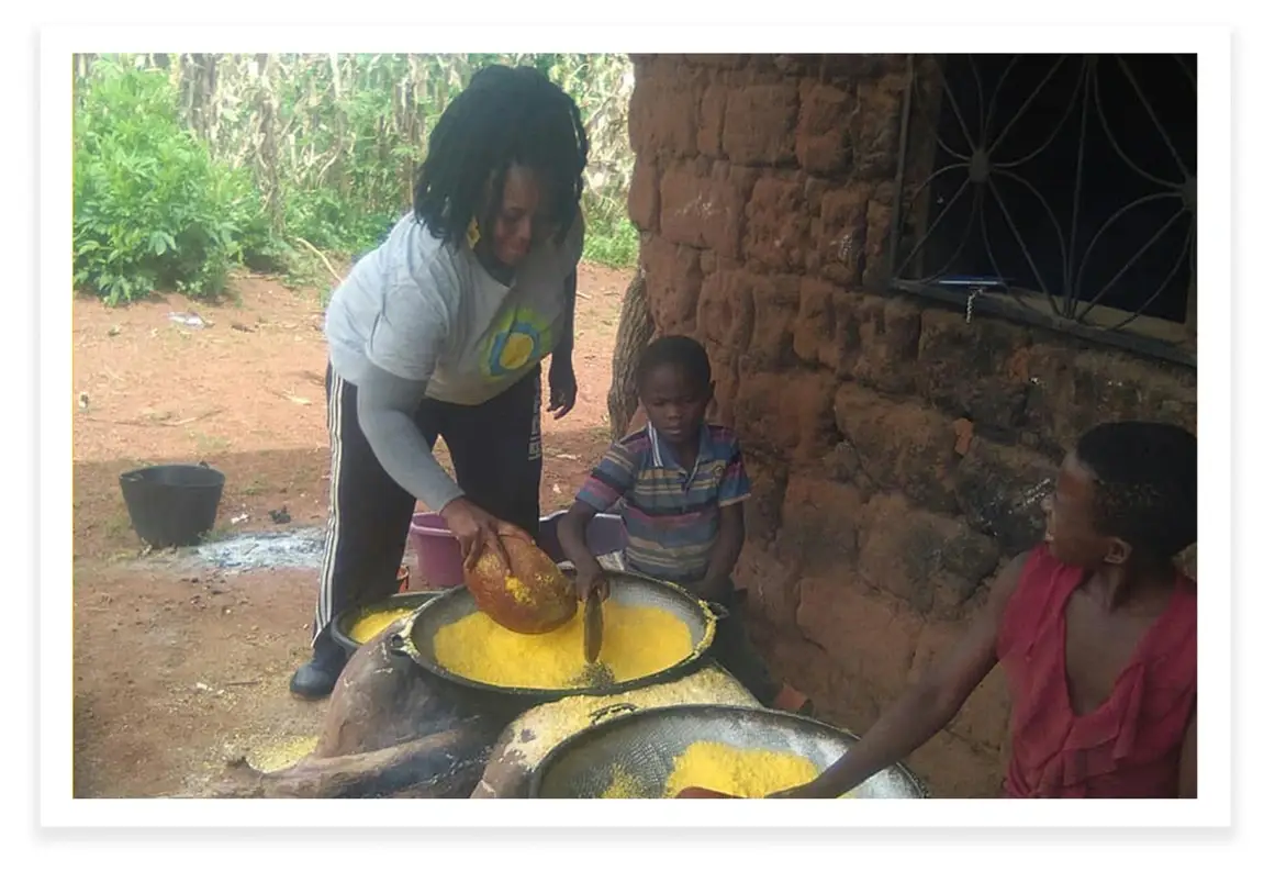 Leontine Sinda, an idealist and humanitarian in Cameroon, teaching the youth to make gari.