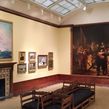 An art museum gallery featuring a large copy of Rembrandt's Night Watch
