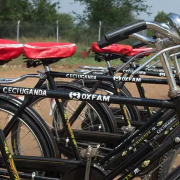 CECI Uganda distributing bicycles loaded with megaphones to community volunteers for awareness raising on covid-19 in Bidibidi Refugee settlement with support from OXFAM in Uganda