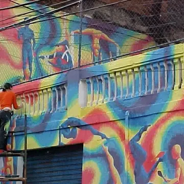 Volunteer painting big murals