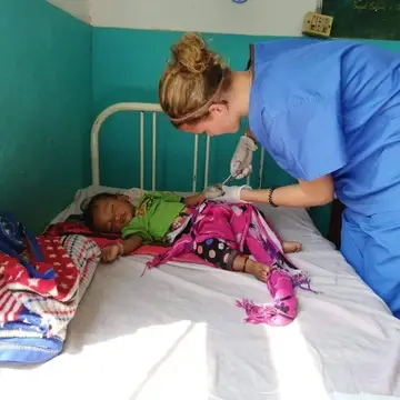 A nursing elective from Austria helping out on the Pediatric ward